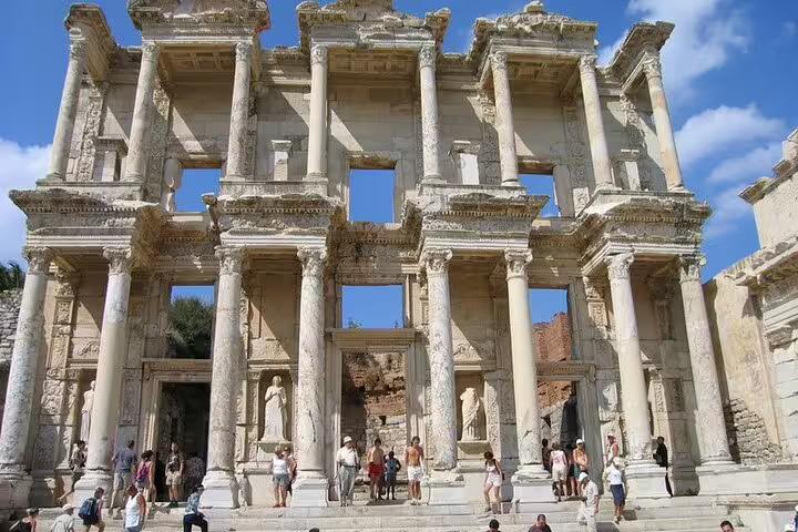 Library of Celsus facade in Ephesus with visitors, key stop on 3-day mini group tour from Kusadasi
