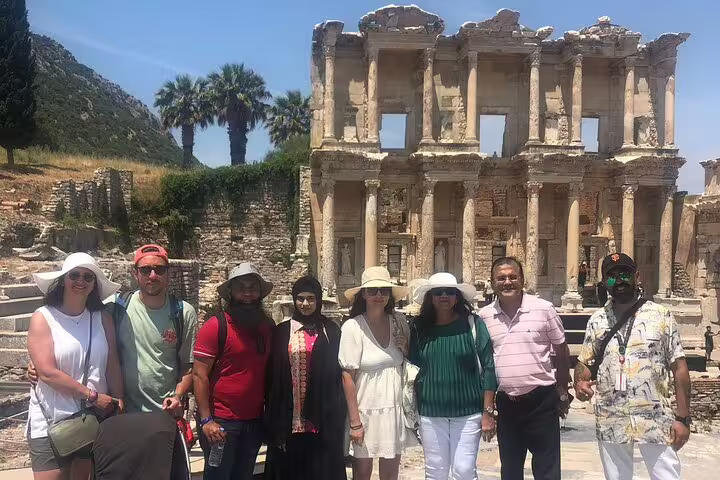 Visitors stand before the iconic Library of Celsus in Ephesus during a memorable private tour from Kusadasi.