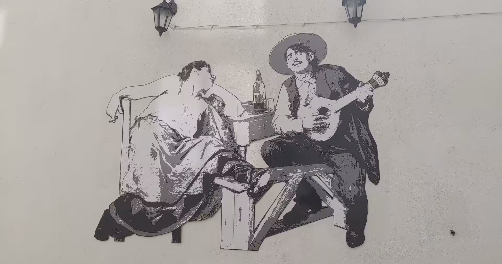 Street art of Portuguese fado musicians in Lisbon, a cultural stop on the Lisbon & Sintra historical tour