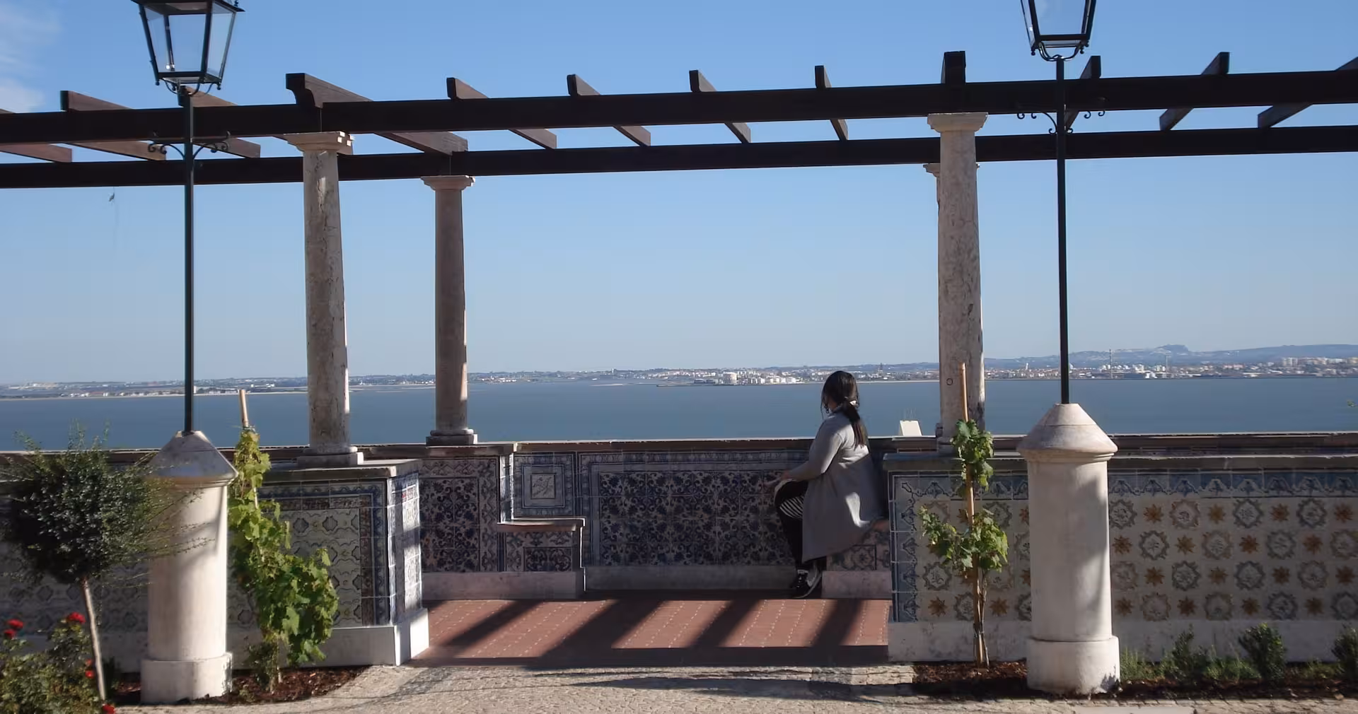 Lisbon miradouro terrace with azulejo tiles overlooking the Tagus River, part of Lisbon & Sintra day tour