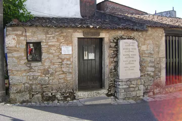 Historic stone façade of the Little Shepherds' house in Fátima, showcasing traditional Portuguese architecture.