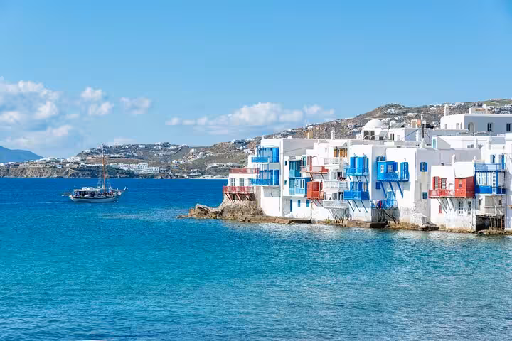 Little Venice Mykonos waterfront with colorful balconies over the sea, seen on a Private Mykonos Classic Island Tour