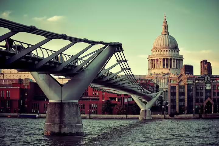 View of London's iconic Millennium Bridge leading to St. Paul's Cathedral, showcasing architectural marvels on a private tour.