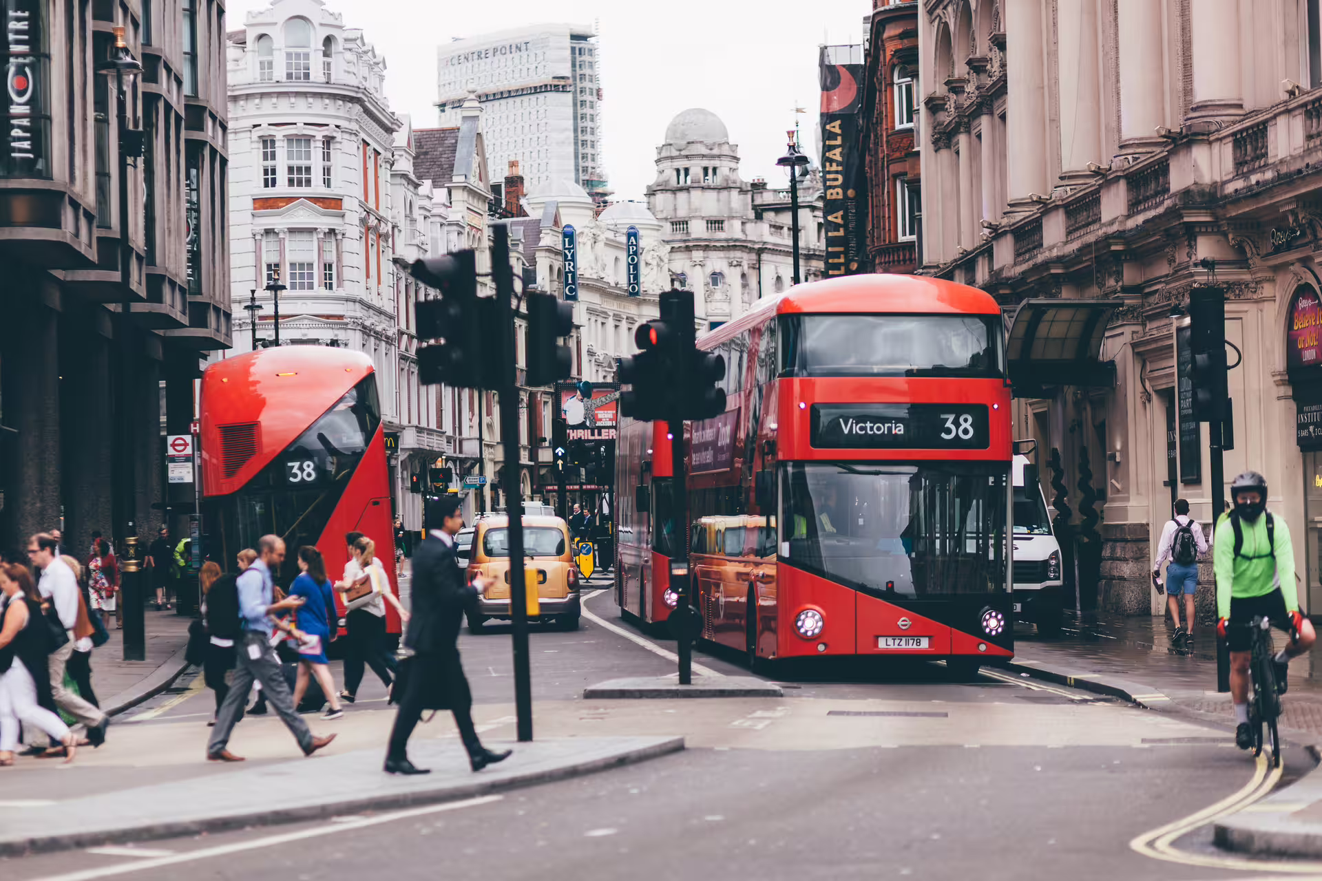 Red double-decker buses on central London street, perfect for London Royal Walk 1-day audioguide tour