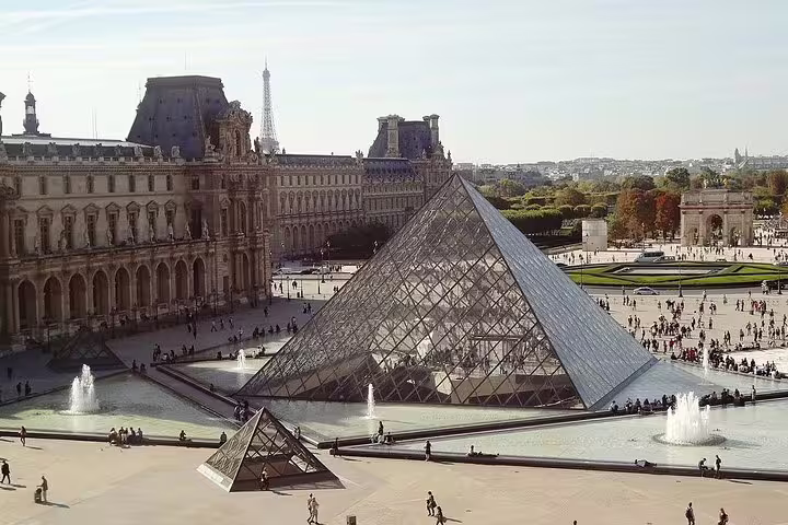 Louvre Pyramid and courtyard seen on a Paris half day private sightseeing tour with driver in luxury vehicle