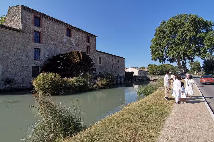 Riverside stone mill and historic village walk, part of the Luberon Wine and Charm Provence day tour