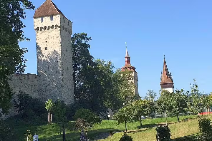 Explore Lucerne's historic Museggmauer towers on a private guided walking tour with hotel pick-up service.