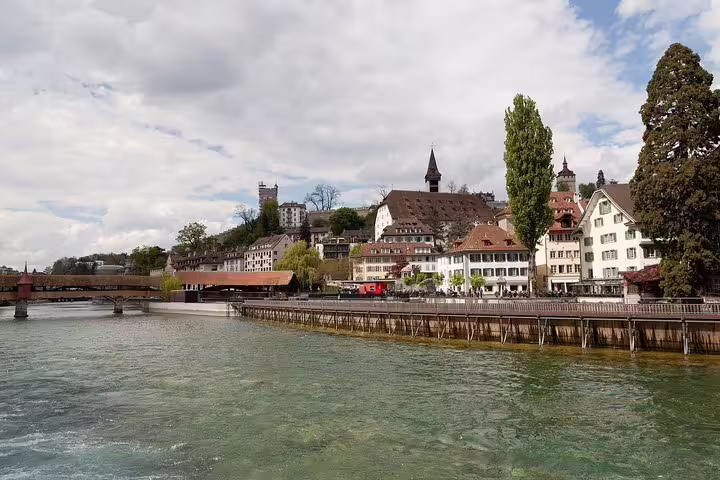 Picturesque Lucerne riverside with historic buildings and scenic views on a classic walking tour.