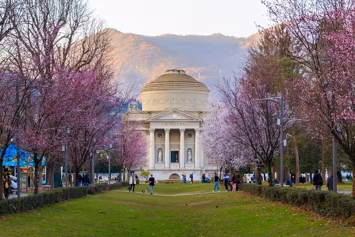 Lugano Parco Ciani with blooming trees and villa, starting point for Como Bellagio cruise plus train