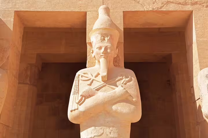 Sunlit ancient pharaoh statue at Abu Simbel, must-see on the 4 days 3 nights Luxor to Abu Simbel package tour