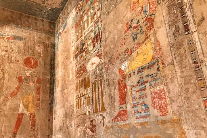 Ancient tomb wall paintings in Luxor on a Sharm El Sheikh to Luxor day trip by plane tour