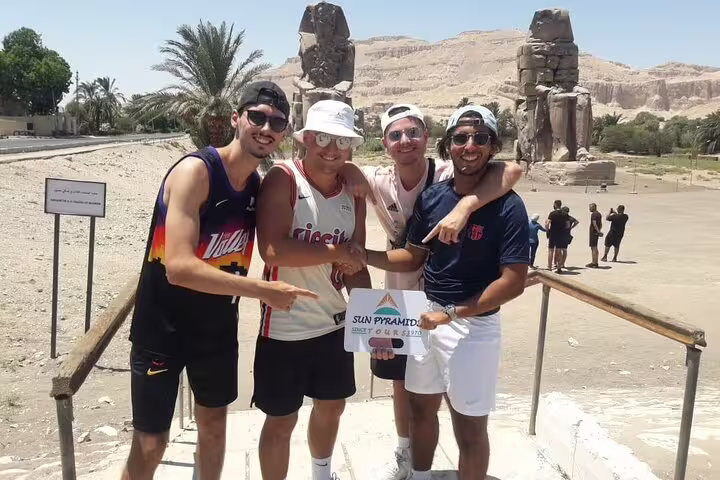 Friends at Luxor Colossi of Memnon on private 3-day city break tour with guided sightseeing and meals