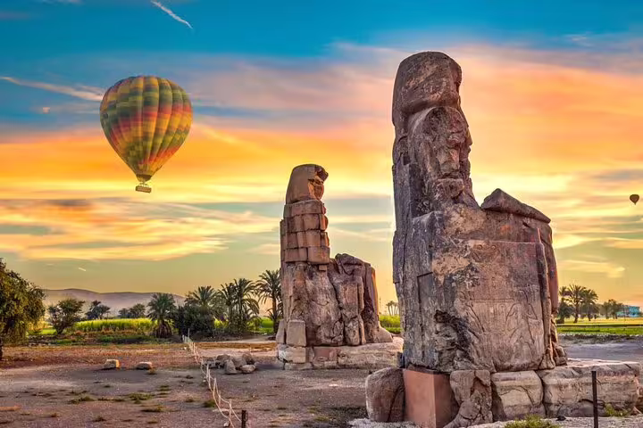 Luxor sunrise balloon flight near Colossi of Memnon statues, with round-trip transfer from your hotel