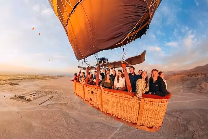 Sunrise hot air balloon ride over Luxor West Bank desert, part of private Luxor tours and Valley of Kings day trip