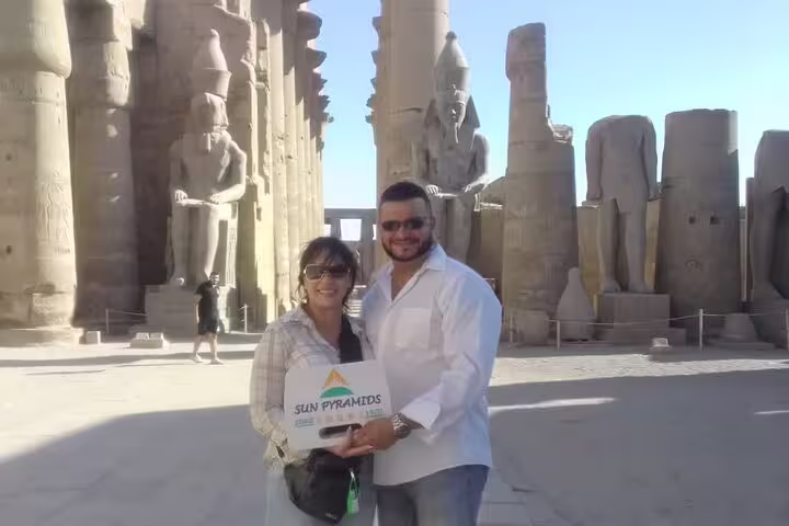 Travelers at Karnak Temple colonnade in Luxor on a 3-day private city break tour with accommodation and meals