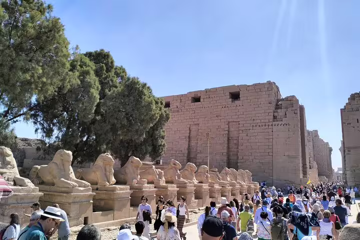 Luxor Karnak Temple avenue of ram sphinxes on Hurghada city tour, crowds exploring ancient Egypt ruins
