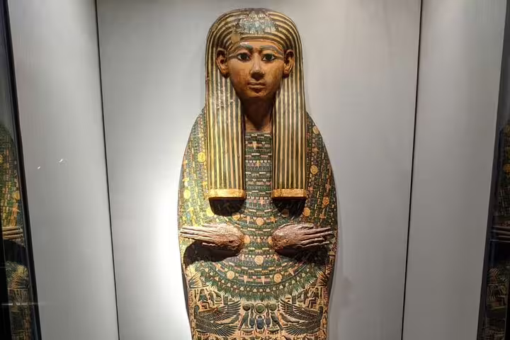 Painted ancient Egyptian sarcophagus in Luxor Museum, highlight of half-day Luxor and Mummification tour