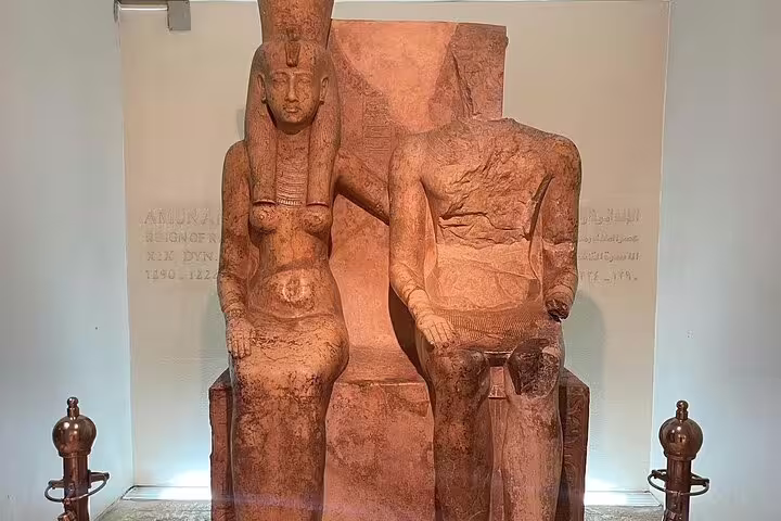 Seated ancient Egyptian royal statues at Luxor Museum, highlight of half-day Luxor and Mummification Museums tour