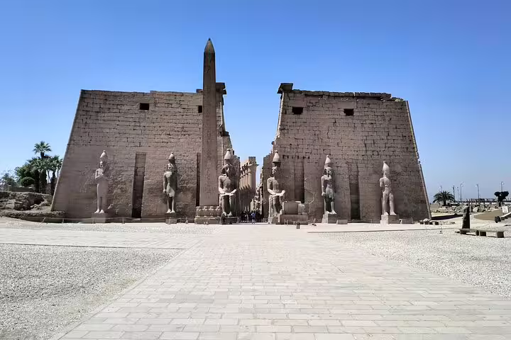 Luxor Temple entrance with statues and obelisk, Egypt highlights on 13-day Egypt Jordan landmarks tour Cairo to Amman