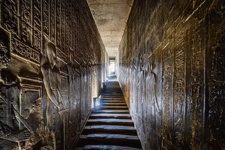Ancient corridor with hieroglyphic carvings in Luxor temple on private overnight tour from Cairo by flight