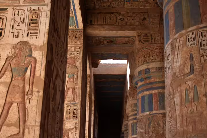 Painted hieroglyphs and columns inside Luxor Temple, a highlight on a 6-day Egypt tours package