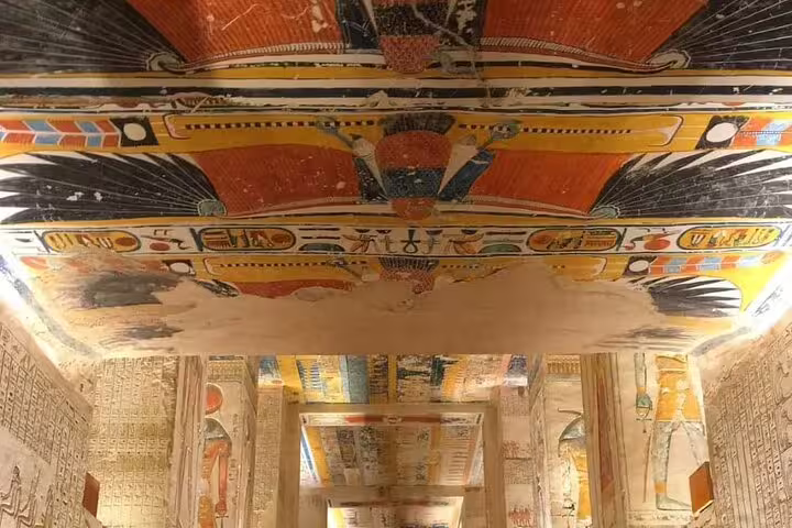 Painted ceiling and hieroglyphs inside a Luxor tomb, Egypt, on 3 nights 2 days Cairo to Luxor sleeper train tour
