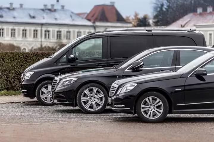 Fleet of luxury black sedans and minivans ready for premium private transfer service from Rome to Sorrento