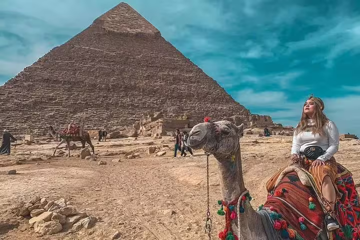 Camel ride at the Great Pyramid of Giza, Cairo, on a luxury Egypt tour from Four Seasons Hotel