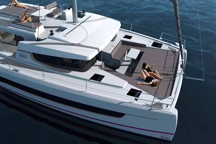 Luxurious catamaran sailing in Limassol, Cyprus with sunbathing deck, perfect for relaxation and scenic Mediterranean views.