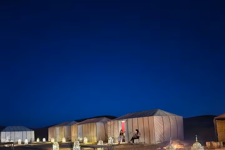 Luxury desert camp under a starlit sky in Merzouga during the 4-day tour from Fes to Marrakech.
