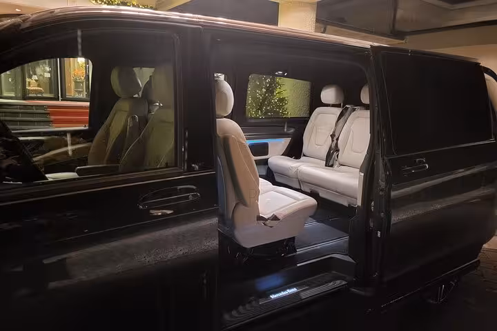 Luxury Mercedes van interior with spacious seats for private transfer from Lucerne to Zurich, Switzerland