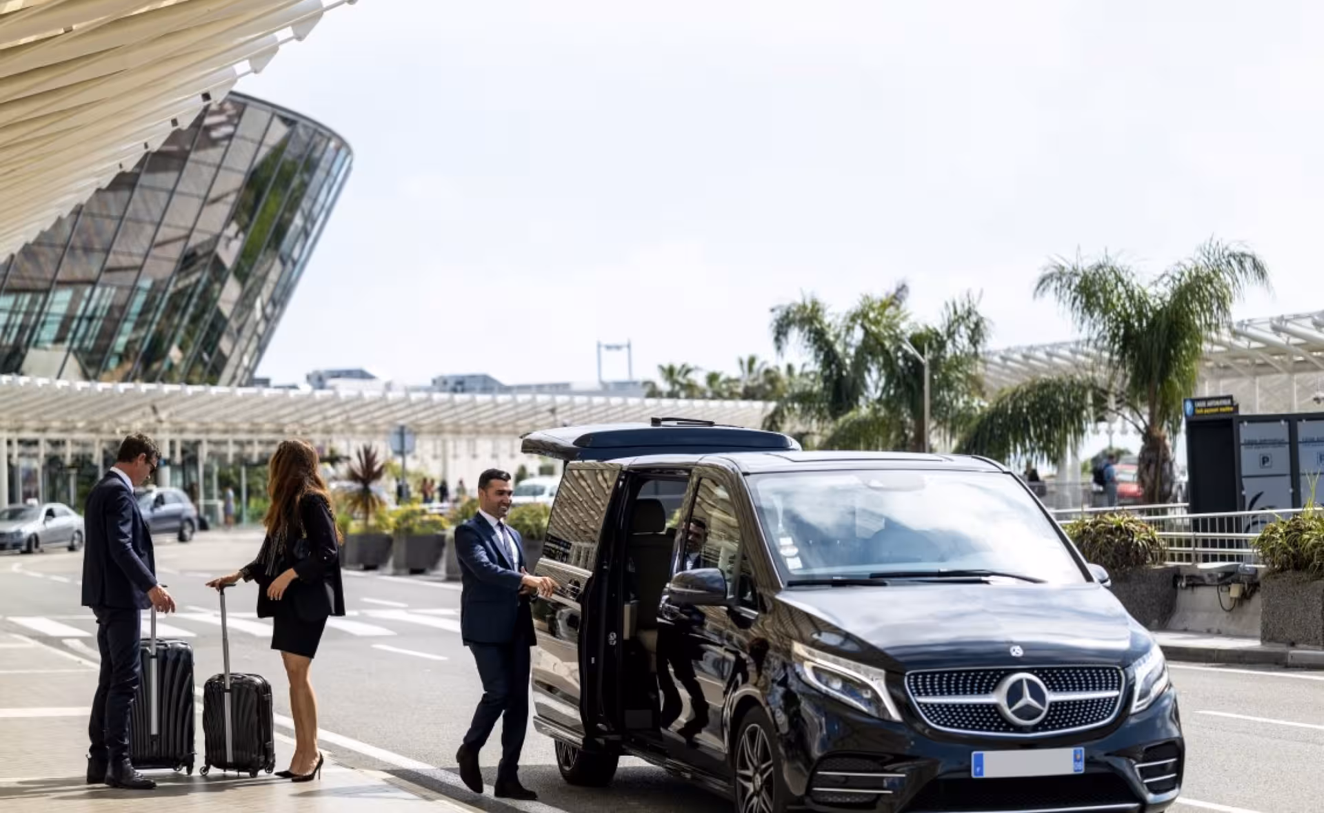 Luxury minivan pickup at Chania Airport for Sfakia and Frangokastello transfer, door open for passengers