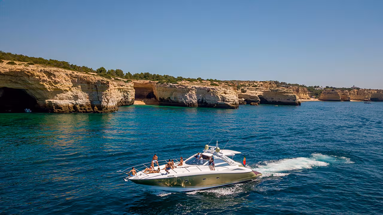 Luxury yacht cruising Algarve sea caves and cliffs on Full Day Cruise Silver 8-hour coastal tour