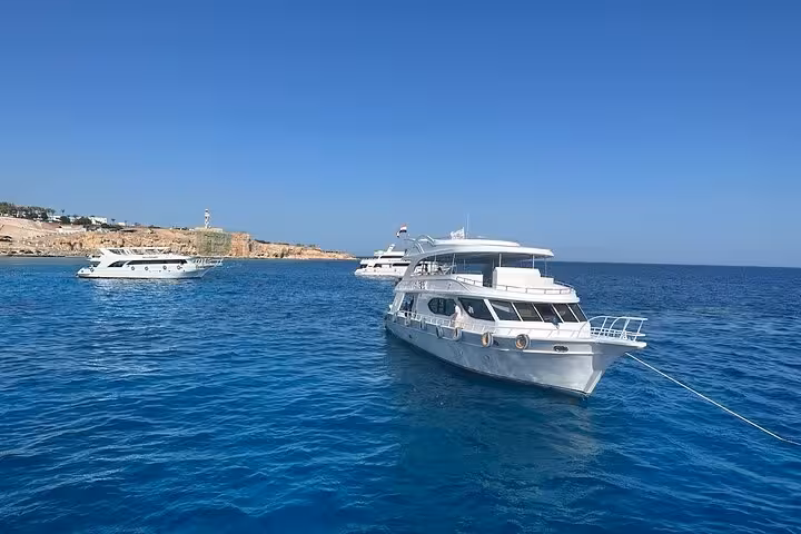 Luxury yacht anchored in the Red Sea on Ras Mohammed and White Island VIP cruise with seafood lunch