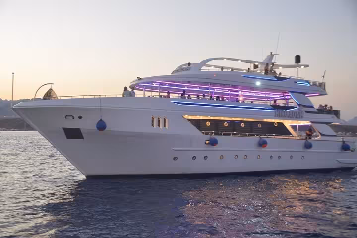Luxury yacht sailing at sunset on Sharm El Sheikh oriental dinner cruise with live belly dance entertainment