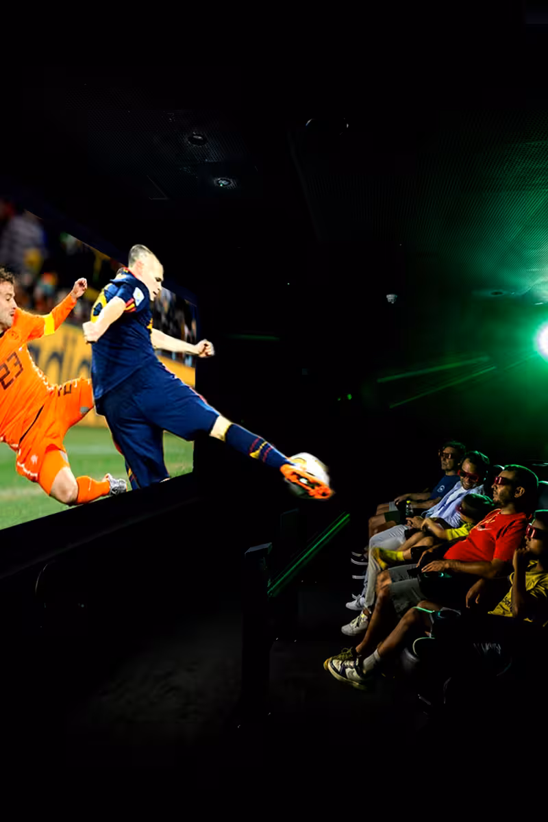 Immersive football cinema in Madrid with fans watching iconic match action on the Legends Home of Football tour