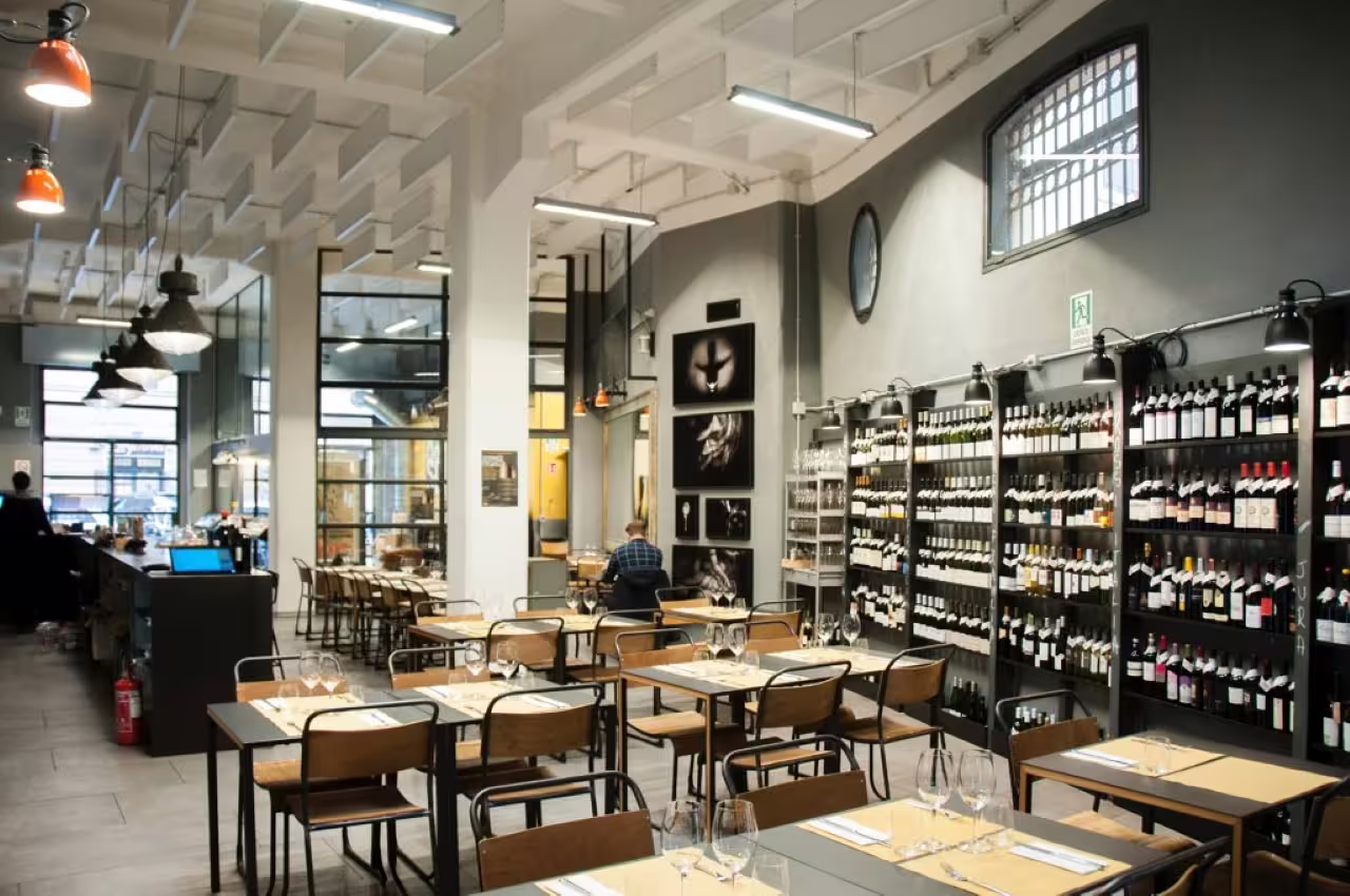 Stylish Magazzino Scipioni dining room in Rome set for elite gourmet tasting with Italian wine pairings