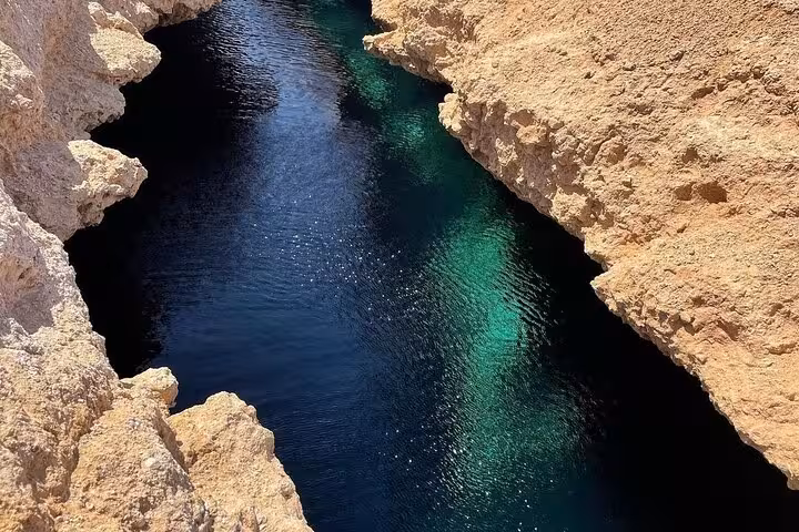 Magic Lake at Ras Mohamed National Park, crystal-clear lagoon between rocks on Sharm El Sheikh snorkeling tour