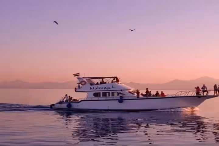 Mahmya Island day cruise boat from Hurghada at sunset, Red Sea snorkeling trip with relaxing sea views