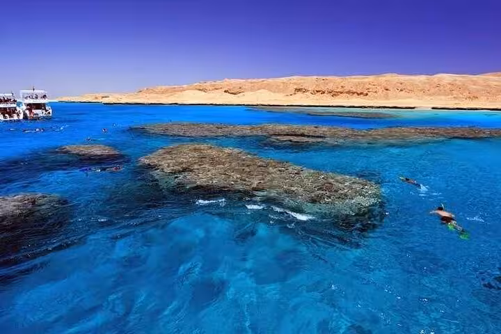 Snorkel coral reefs in crystal-clear Red Sea waters on a full-day Mahmya Island boat trip from Hurghada
