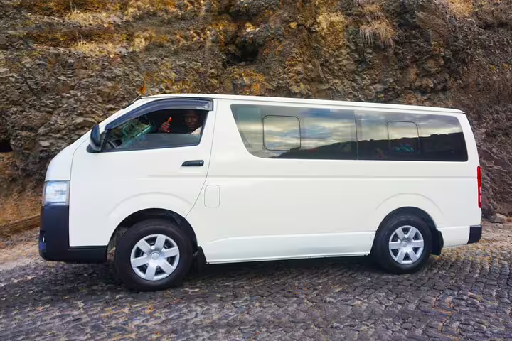 White minivan for Maio private airport transfer service to Calheta, comfortable door-to-door ride