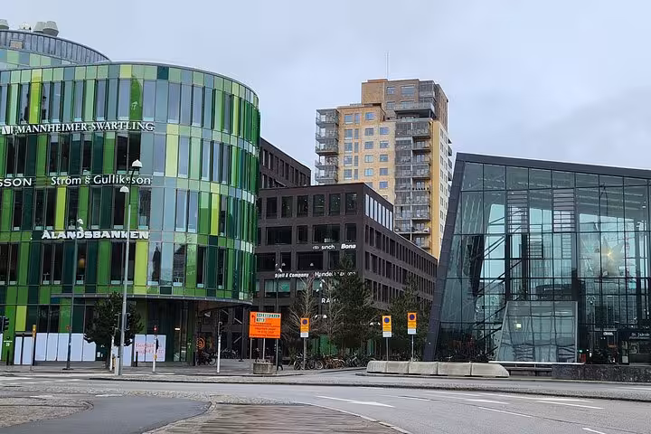 Contemporary architecture in Malmö with vibrant green glass buildings featured in a 4-hour city highlights tour.