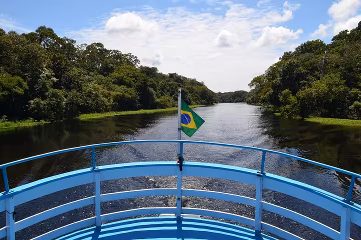 View from boat deck on Manaus to Tabatinga route, cruising the Amazon River through rainforest scenery