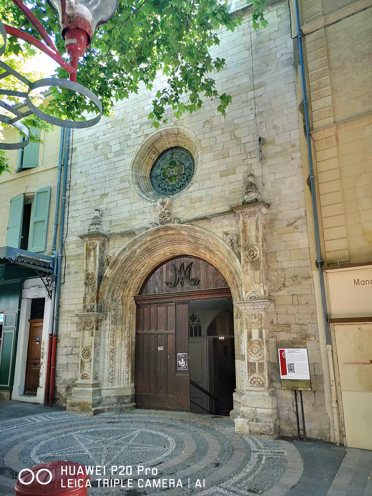Historic church doorway and stone facade in Manosque, Provence on private Marseille shore excursion day tour