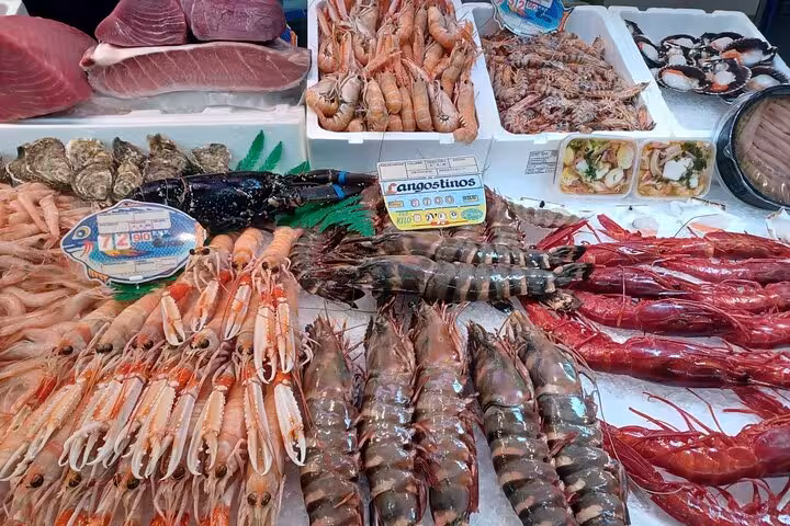 Fresh seafood selection with prawns, oysters, and fish at Marbella market, perfect for a culinary tour experience.