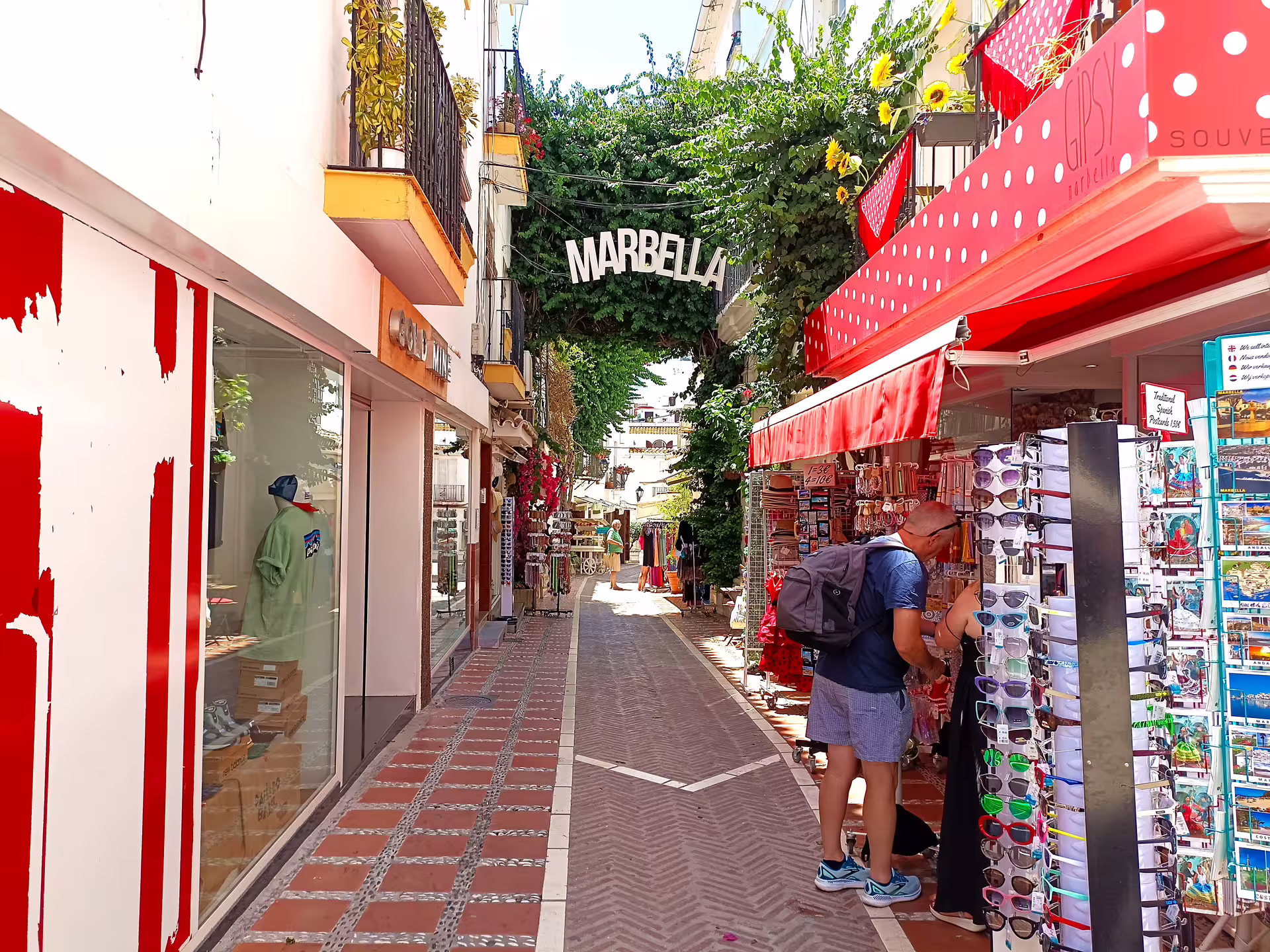 Marbella old town shopping street with souvenir stalls, part of Ronda and Marbella private tour with hotel pick-up