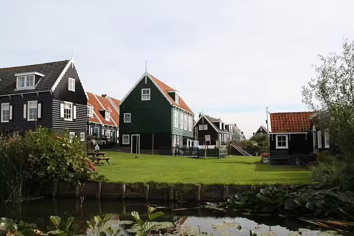 Traditional wooden houses and canal in Marken village on private day trip from Amsterdam to Volendam