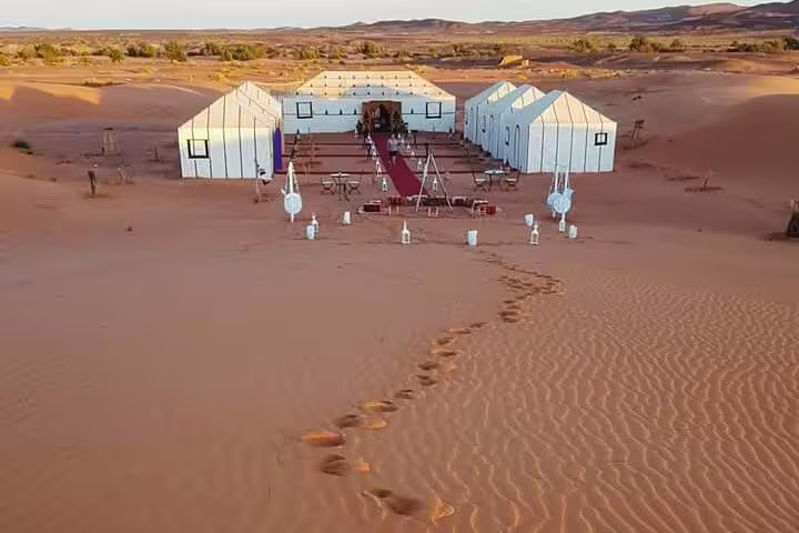 Luxury Merzouga desert camp on Sahara dunes, overnight stay on 4 days 3 nights tour from Marrakech