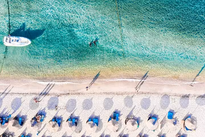Aerial view of Marsa Alam beach and crystal Red Sea lagoon, starting point for private turtle and dugong swim tour