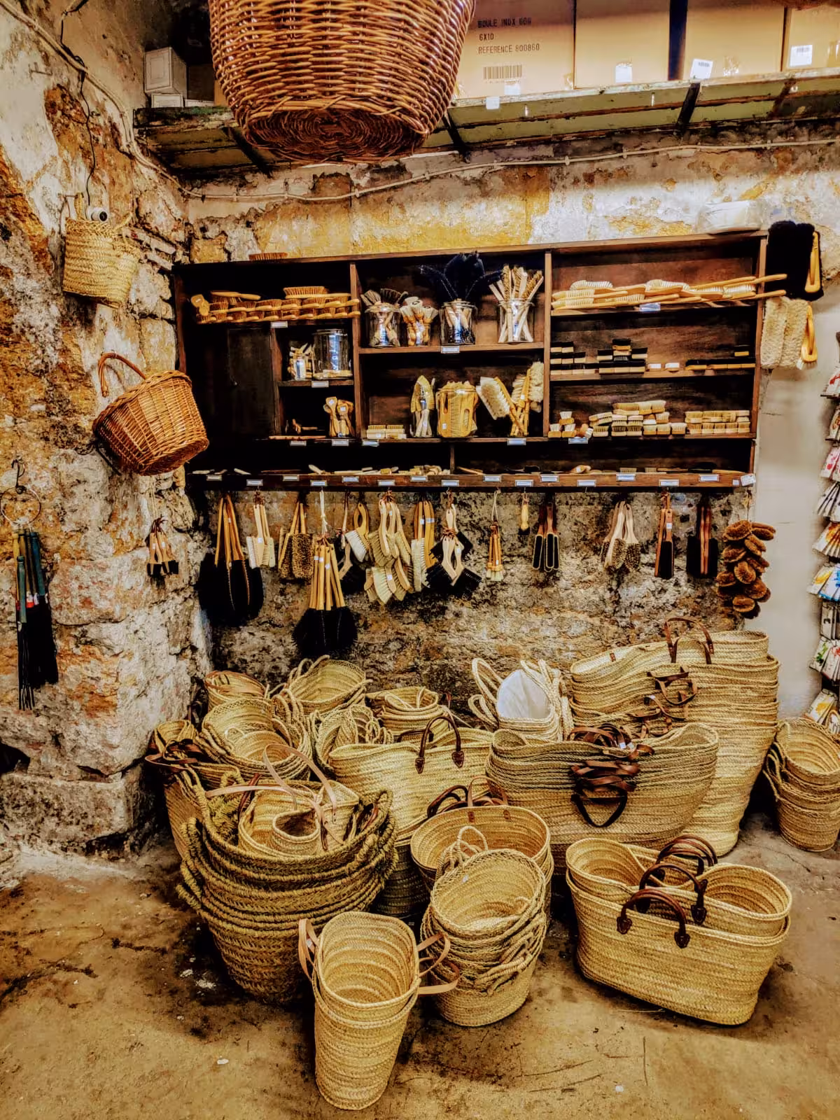 Handwoven baskets and brushes in a Marseille artisan shop, authentic shopping on a 3-day local tour